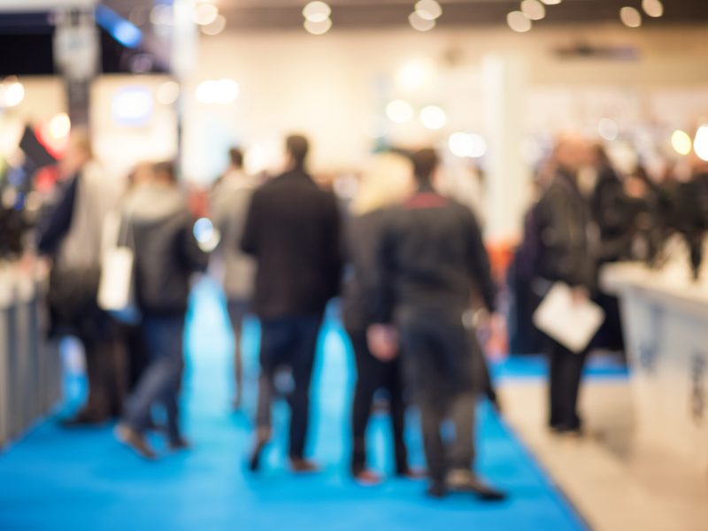 Defocused shot of crowd  on exhibition. Purposely blurred with a lens.